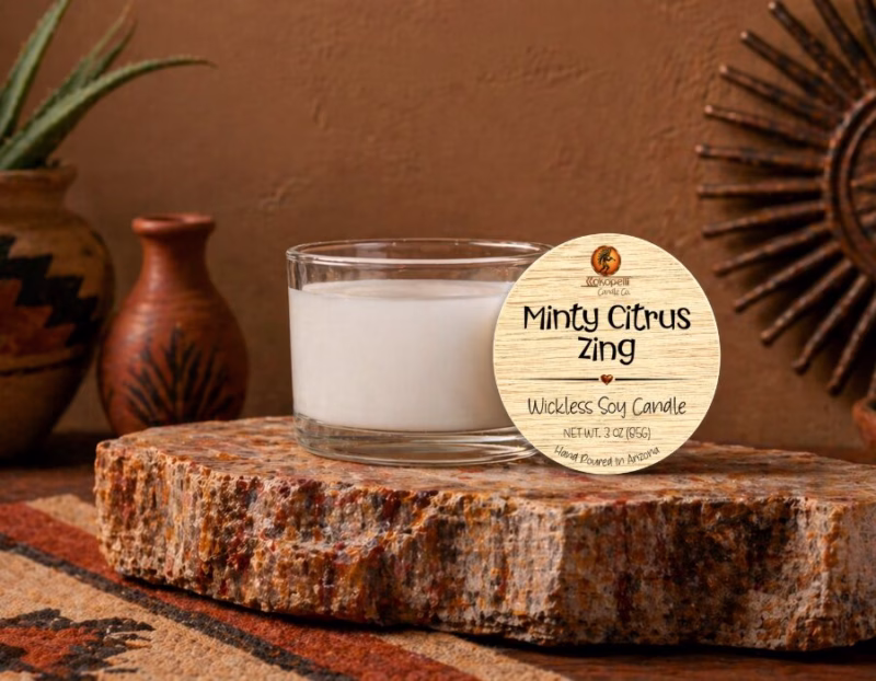 Minty Citrus Zing wickless soy candle on a natural stone display with Southwest décor, handcrafted in Arizona.