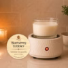 Blueberry Cobbler wickless soy candle warming on a ceramic candle warmer, featuring creamy white soy wax in a clear glass vessel with a warm ambient glow in a cozy home setting.