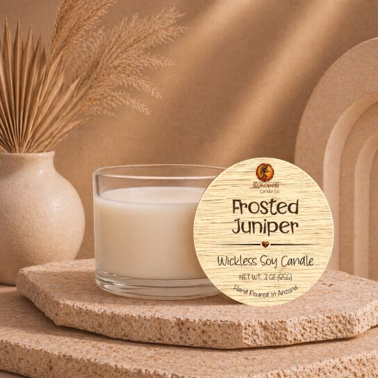 3 oz Frosted Juniper wickless soy candle with natural bamboo lid displayed on a stone pedestal in a warm Southwest-inspired setting, handcrafted by Kokopelli Candle Co. in Arizona.