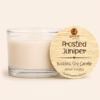 Frosted Juniper wickless soy candle in a clear glass vessel with creamy white soy wax and a natural wood lid, hand poured in Arizona.