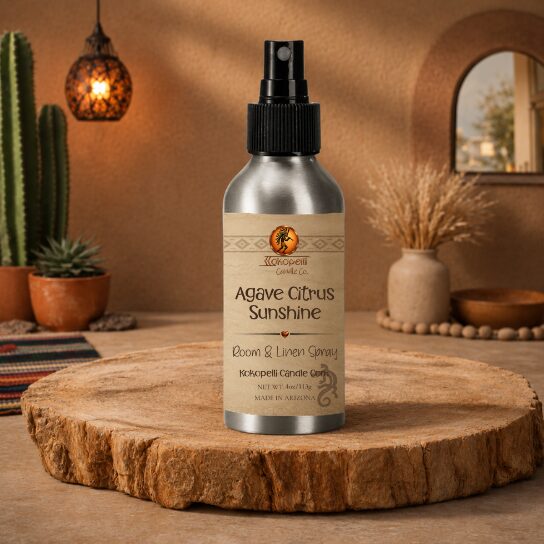 Agave Citrus Sunshine Room & Linen Spray by Kokopelli Candle Co displayed on petrified wood in a warm Southwest-inspired room with cactus décor and soft desert lighting.