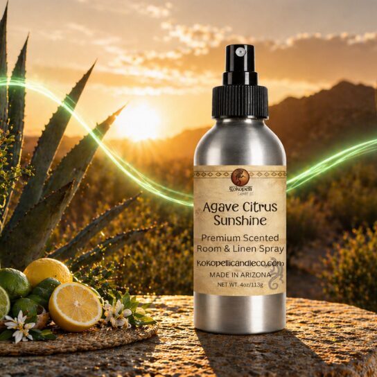 Agave Citrus Sunshine Room & Linen Spray by Kokopelli Candle Co displayed in an Arizona desert sunset scene with citrus fruits, agave plants, and glowing green swirl accents.