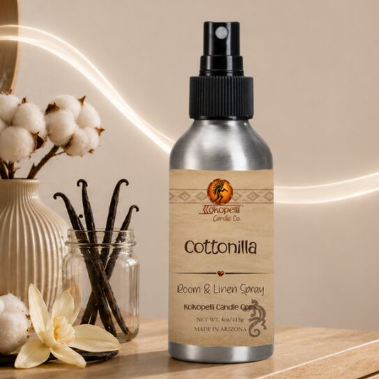 Cottonilla Room & Linen Spray by Kokopelli Candle Co displayed with vanilla beans, cotton stems, and soft glowing accents in a warm neutral setting.